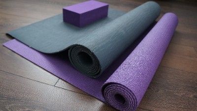 Grey and purple yoga mats with block